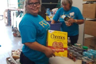 October 4 FOCUS Community News Photo of Volunteers Packing Food Boxes