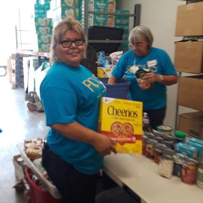 October 4 FOCUS Community News Photo of Volunteers Packing Food Boxes